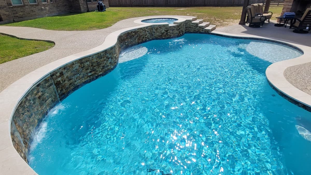 Houston backyard pool being cleaned during algae season
