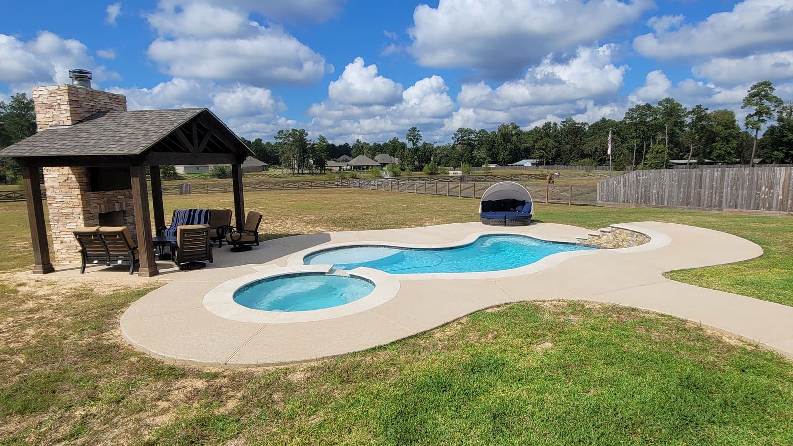 Freeform pool and spa with covered cabana