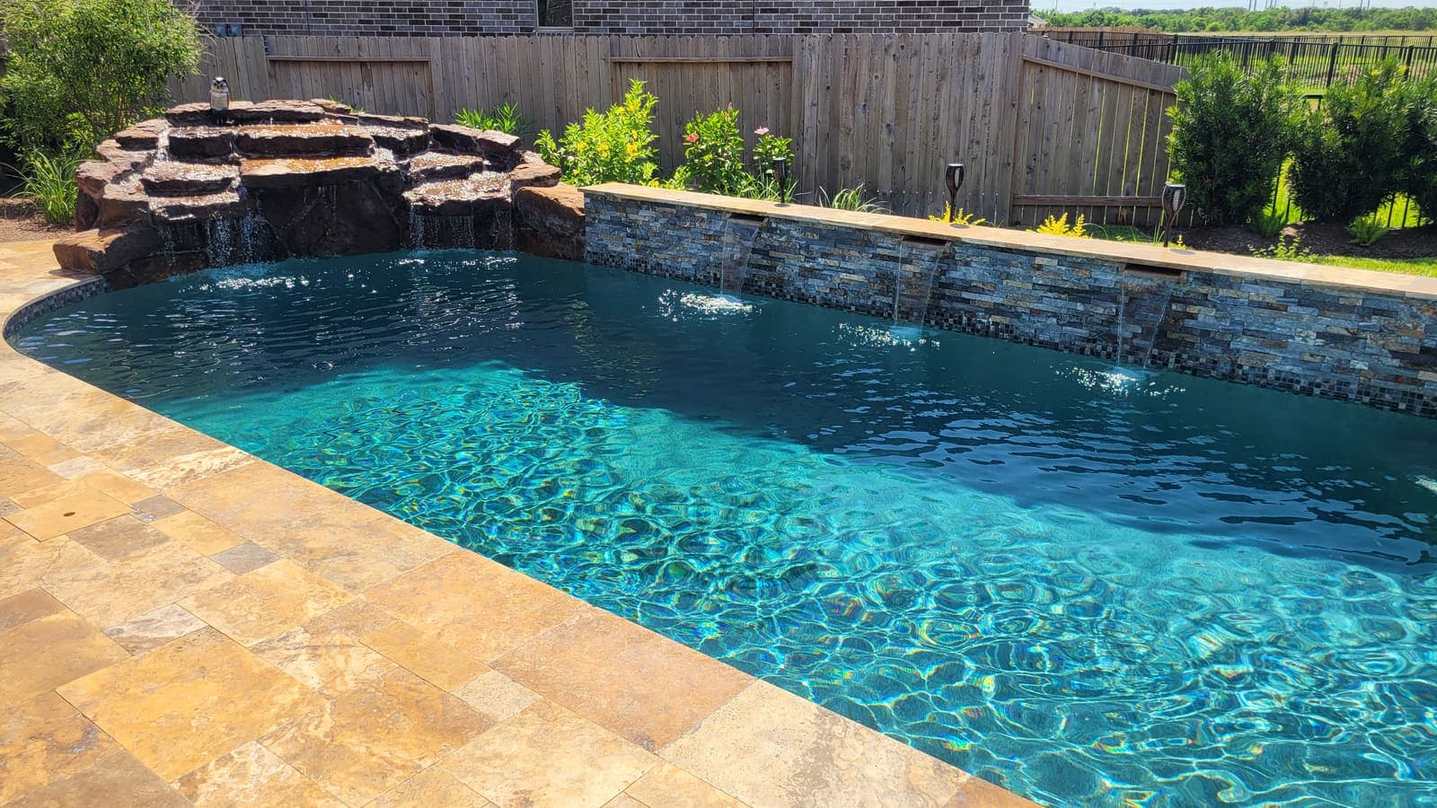 Pool with natural stone waterfall feature
