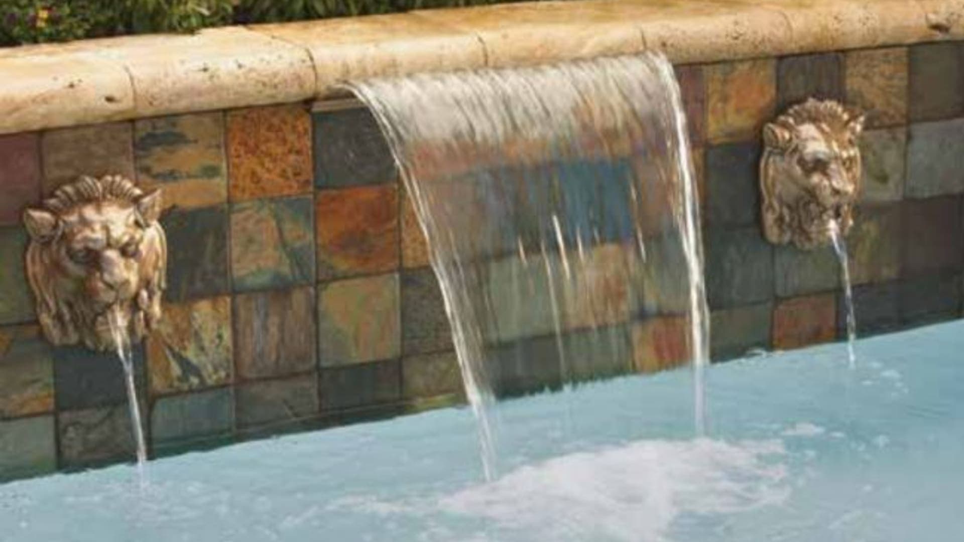 Sheer descent waterfall on a stacked-stone wall