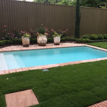 Geometric pool by Houston Cool Pools - rectangular pool with straight brick coping