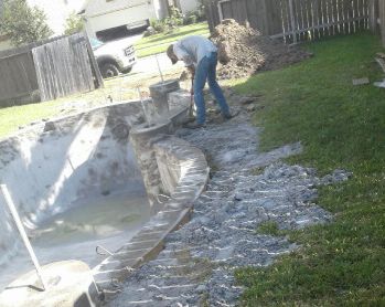 Final clean-up around the finished pool with the property fence restored