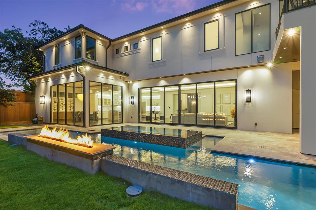 Fire pit by Houston Cool Pools - raised linear fire feature beside the pool