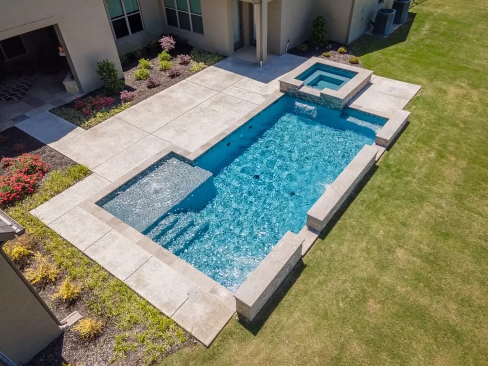 Geometric pool by Houston Cool Pools - aerial view of rectangular pool with raised spa