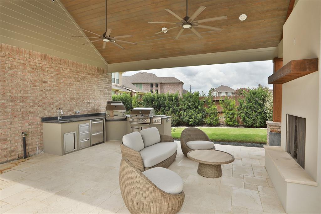 Outdoor structure by Houston Cool Pools - covered patio with wood ceiling and lounge seating