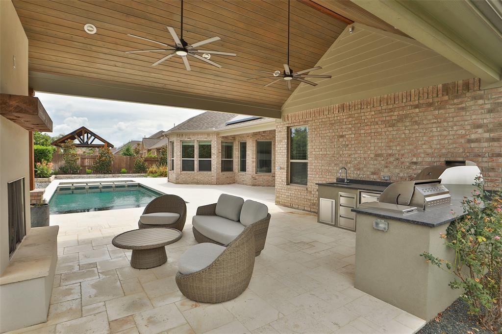 Outdoor structure by Houston Cool Pools - covered patio with columns overlooking pool