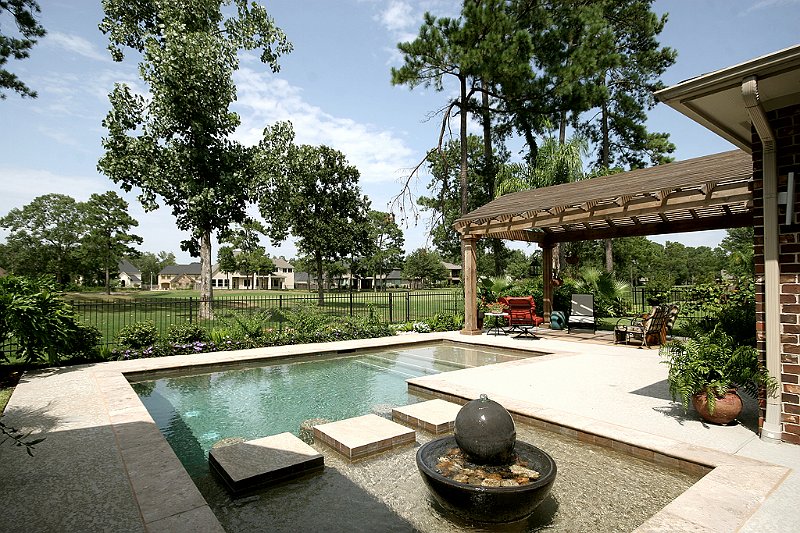Geometric pool by Houston Cool Pools - rectangular pool with fountain feature