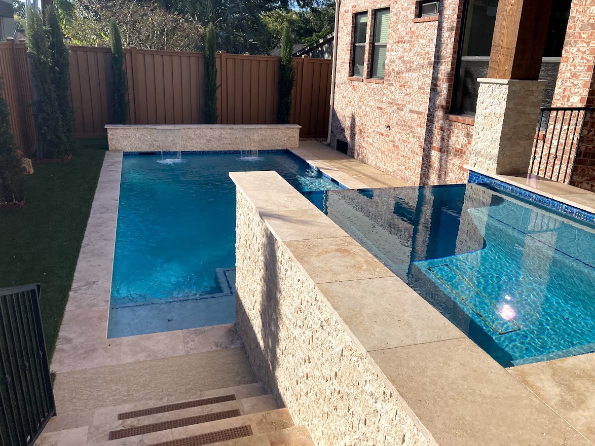 Pool deck by Houston Cool Pools - courtyard setting