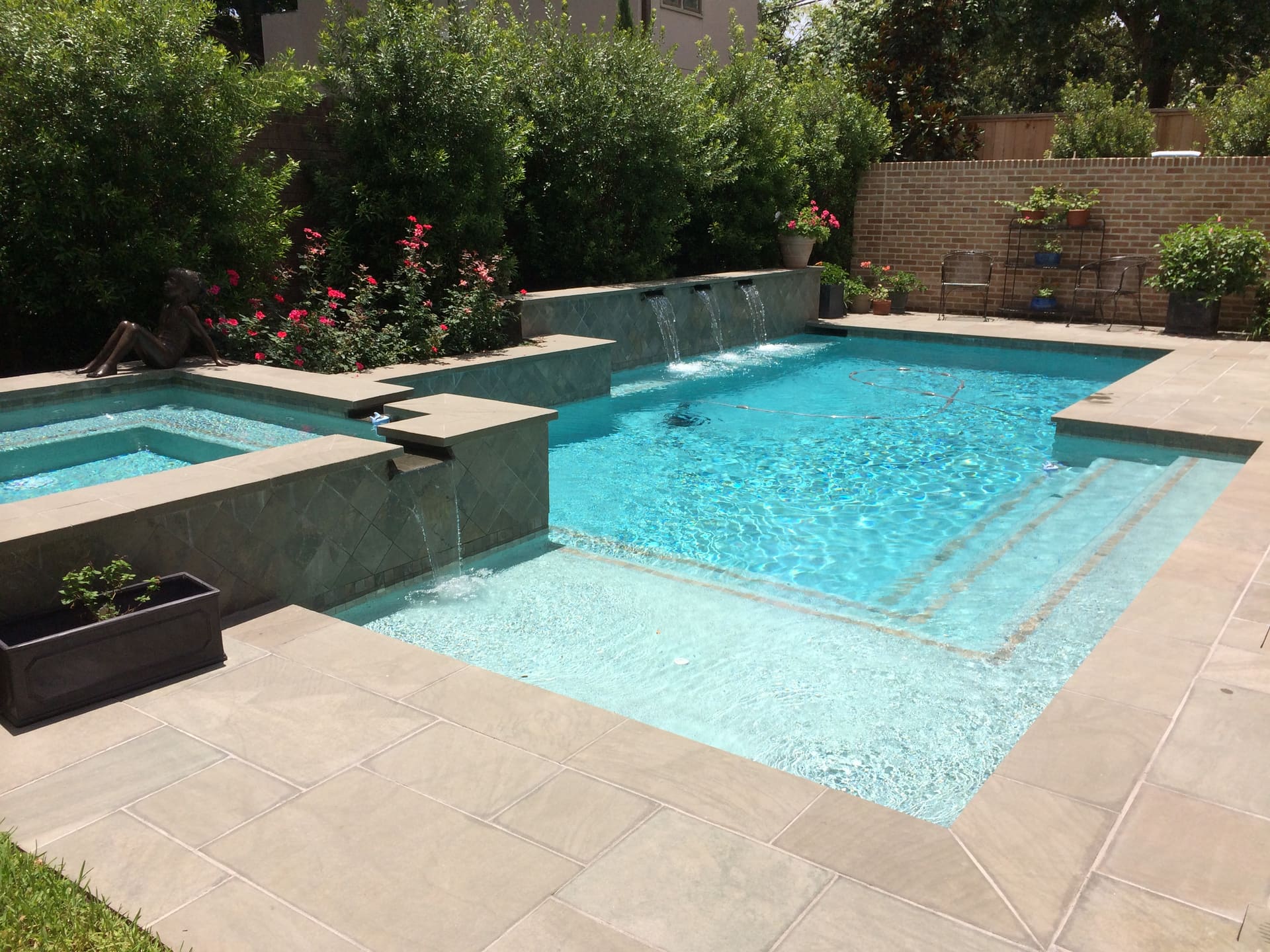 Geometric pool by Houston Cool Pools - rectangular pool with fountains