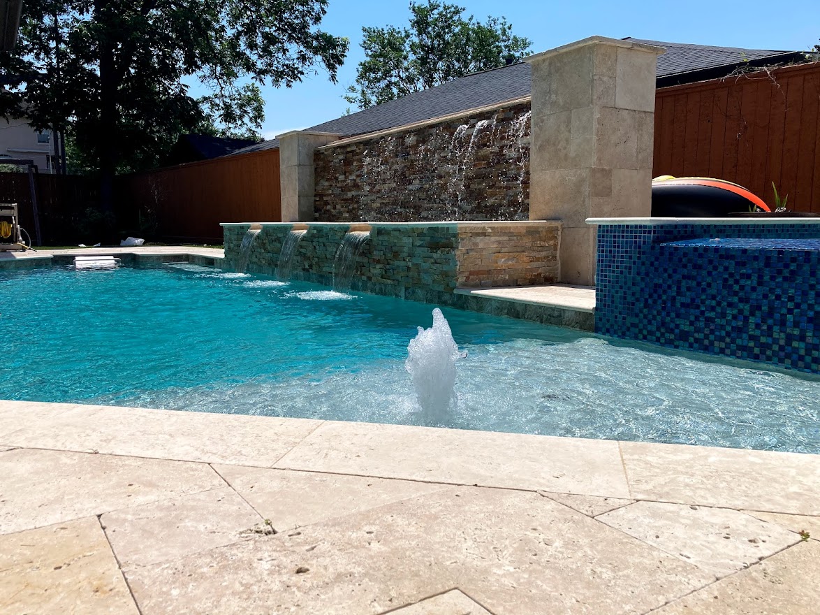 Pool deck by Houston Cool Pools - backyard environment with seating