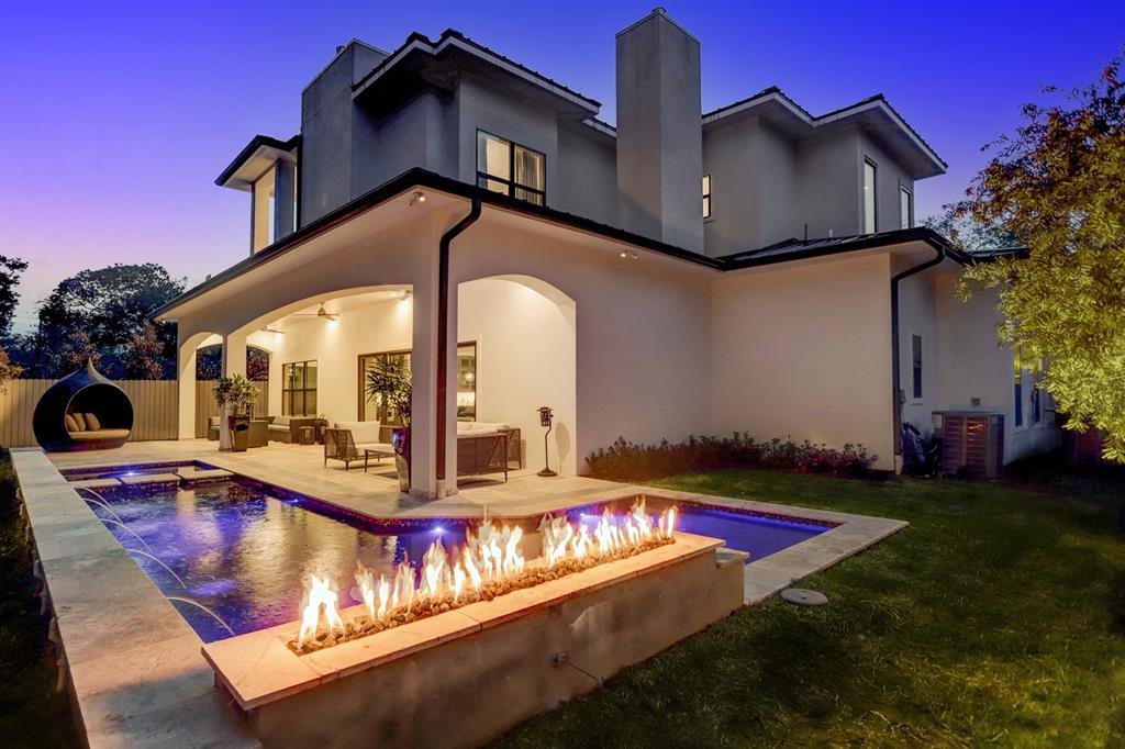 Geometric pool by Houston Cool Pools - rectangular pool and spa with fire feature