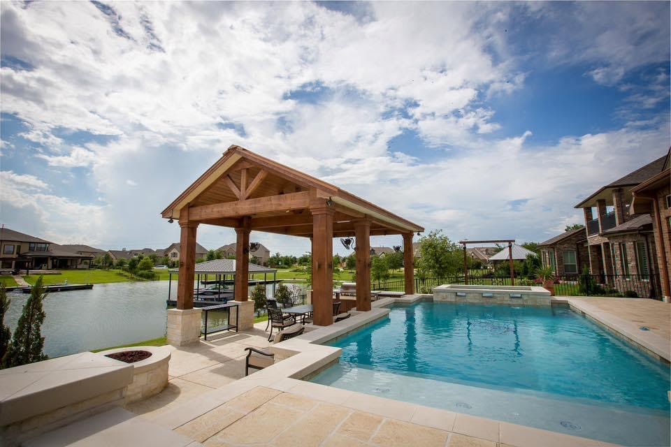 Outdoor structure by Houston Cool Pools - lakeside wood pavilion with pool
