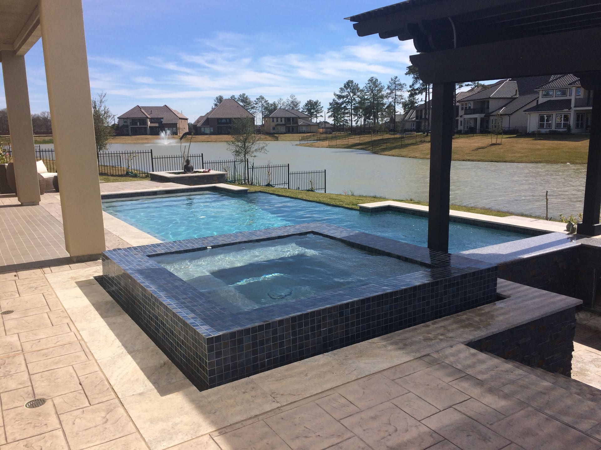 Geometric pool by Houston Cool Pools - rectangular reflecting pool by the lake