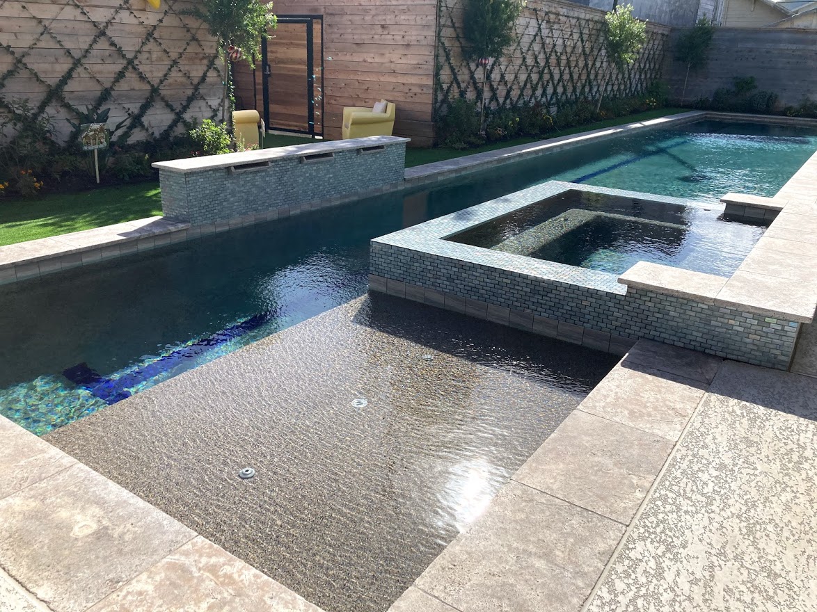 Geometric pool by Houston Cool Pools - rectangular lap pool with sun shelf